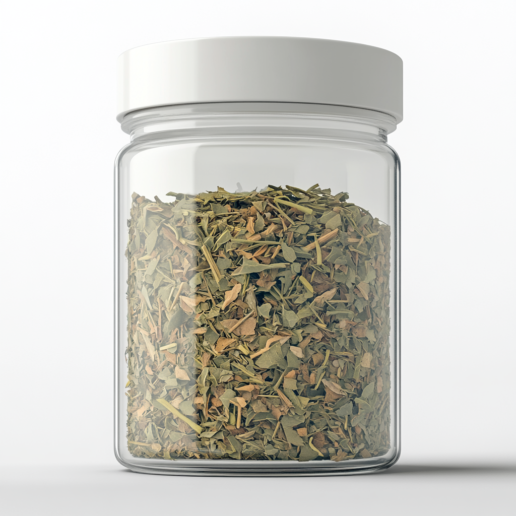 Dried spearmint & lemongrass tea leaves in transparent jar.