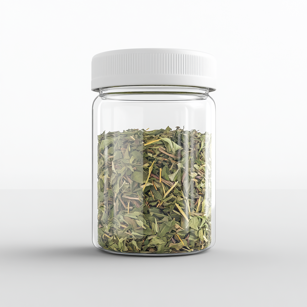 Dried spearmint & lemongrass tea leaves in transparent jar.