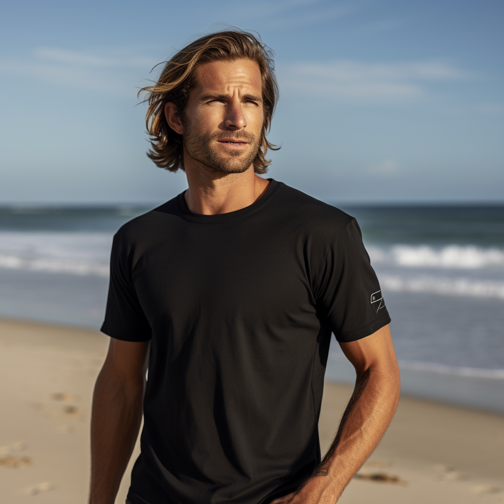 Linod surfer in black t-shirt riding waves on the beach